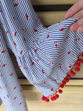 Blue & White Striped Off-Shoulder Top with Red Pom Trim